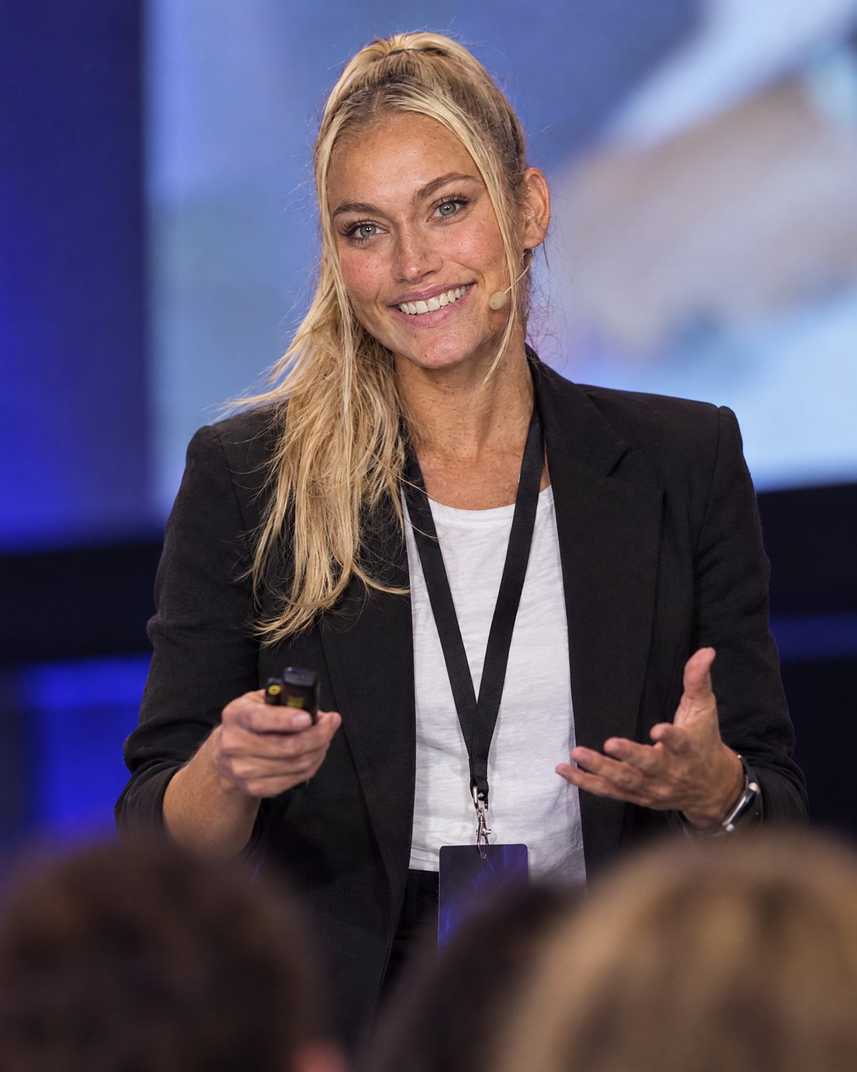 Nina Vellin presenting at a conference, photographed from the audience.